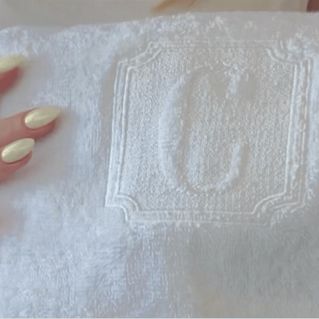 Monogrammed white towel with hotel spa style embossed initial at 10Bay.store